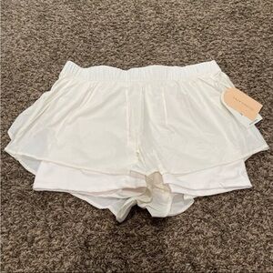 Blogilates NWT, ruffle shorts in sugar swizzle size XL